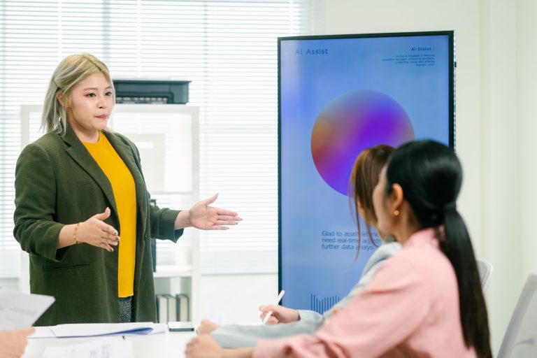 Woman discussing presentation with her co-workers