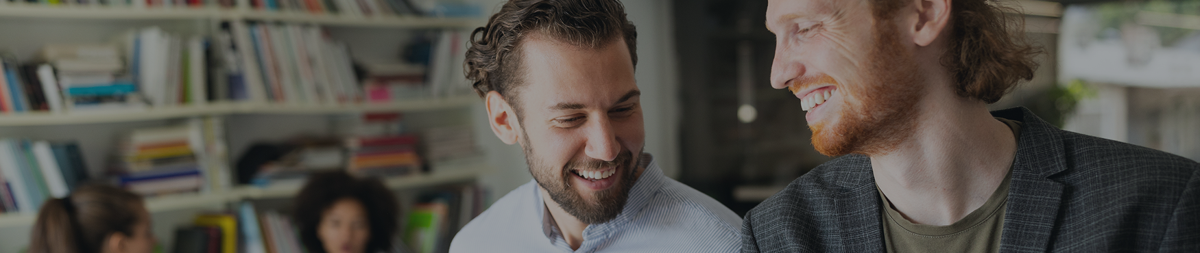 a man smiling with a beard