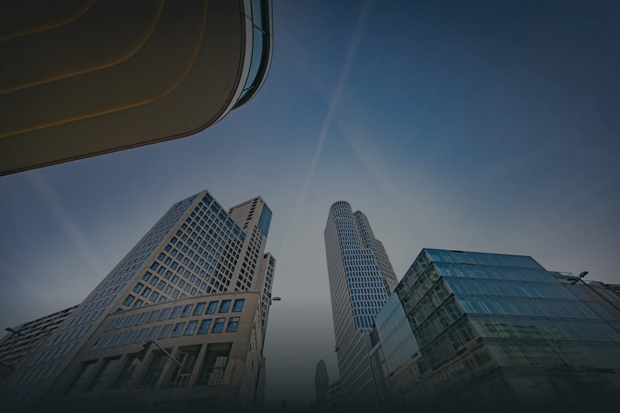 looking up view of a city with tall buildings