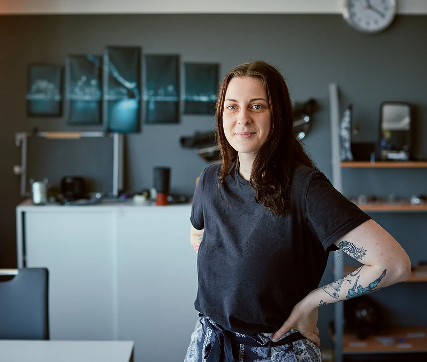 a woman with tattoos on her arm