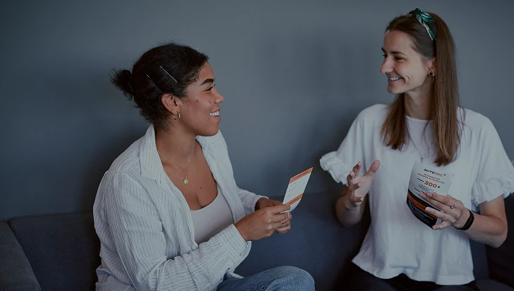 a woman talking to another woman