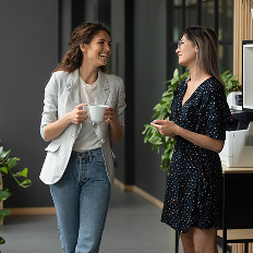 two women standing in a room