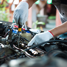 a person working on a car engine